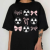 Y2K Graphic T-Shirt with pink bows and radioactive heart design on black oversized tee.